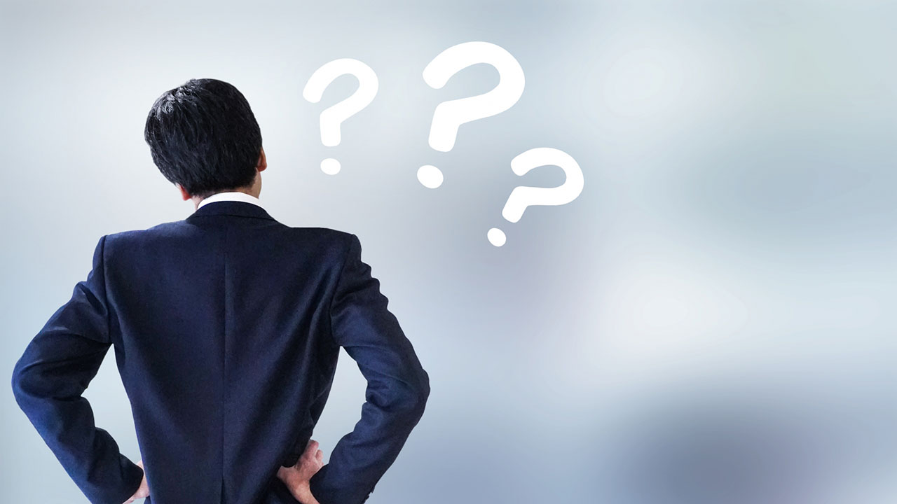 疑問を浮かべる男性の画像